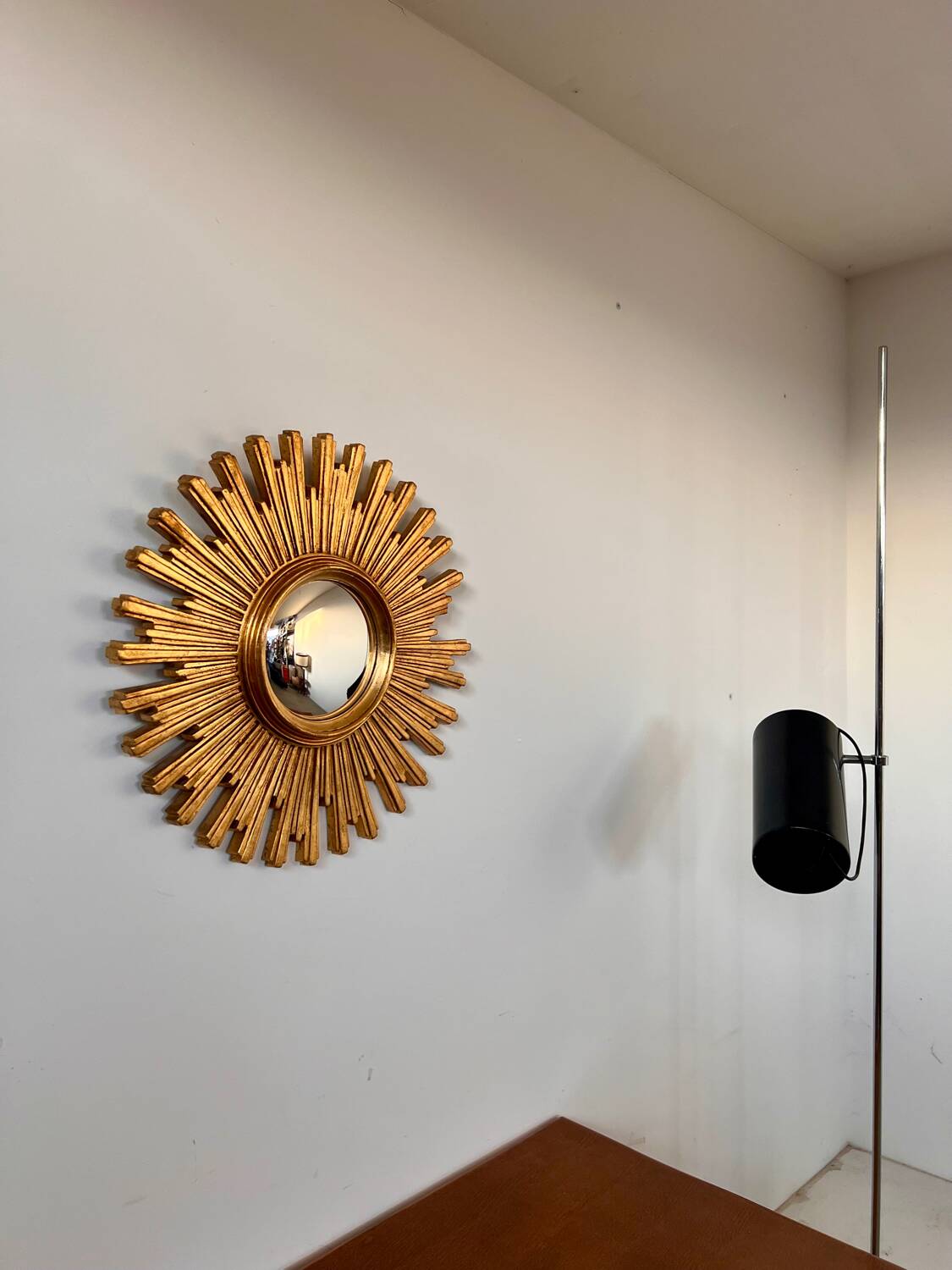 Old large golden sun mirror with rounded witch's eye in vintage resin from the 70s