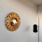 Old large golden sun mirror with rounded witch's eye in vintage resin from the 70s