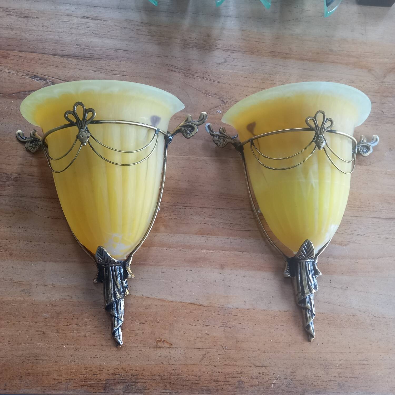 Art deco bronze wall lights with yellow glass