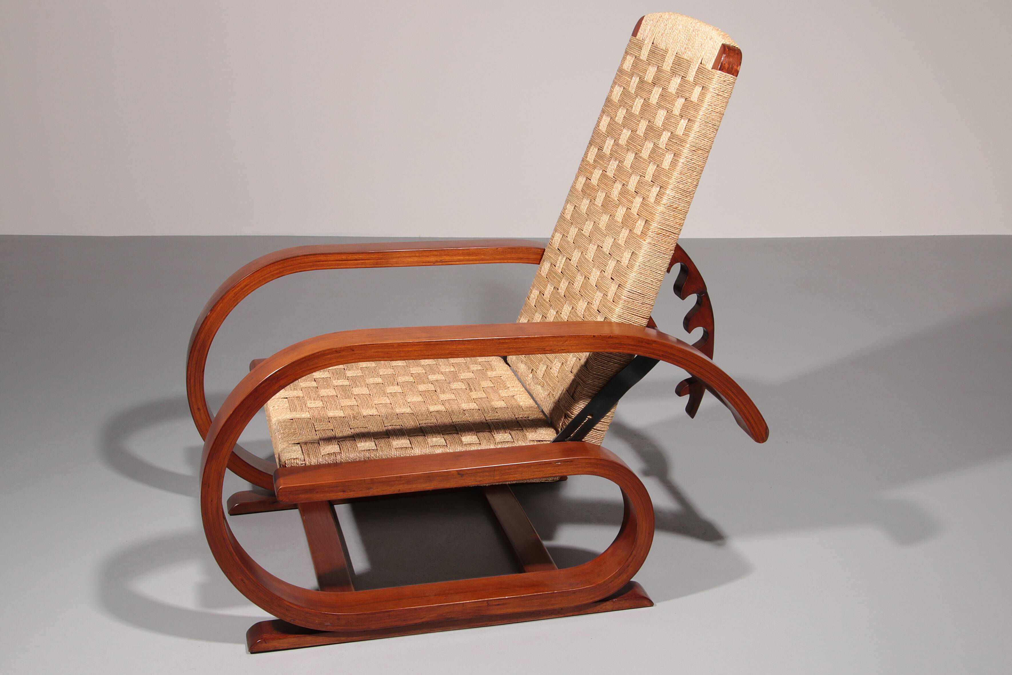 An exceptionally rare mahogany recliner crafted in Italy during the 1950s"