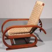 An exceptionally rare mahogany recliner crafted in Italy during the 1950s"