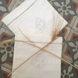 Two matching mixed pillowcases embroidered A B