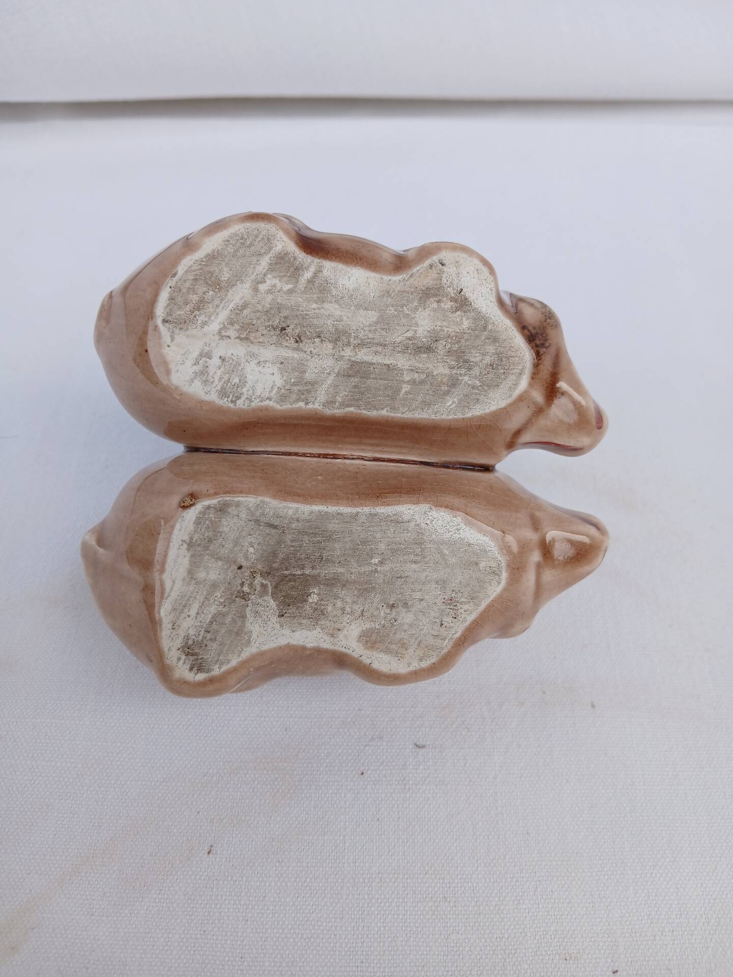 Old ceramic salt and pepper shaker in the shape of pigs.
