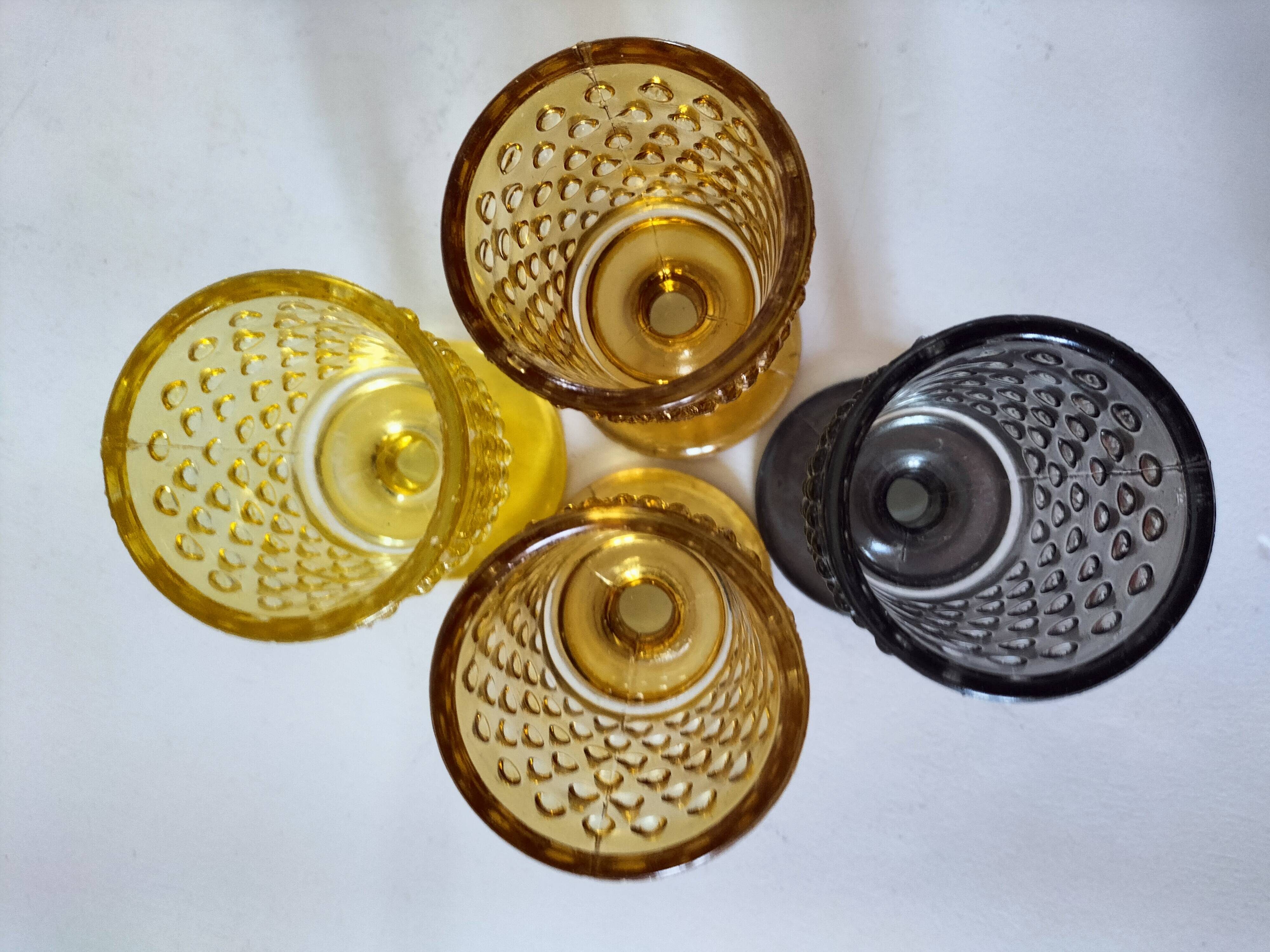 4 vintage stemmed glasses in hobnail glass and smoke colour.