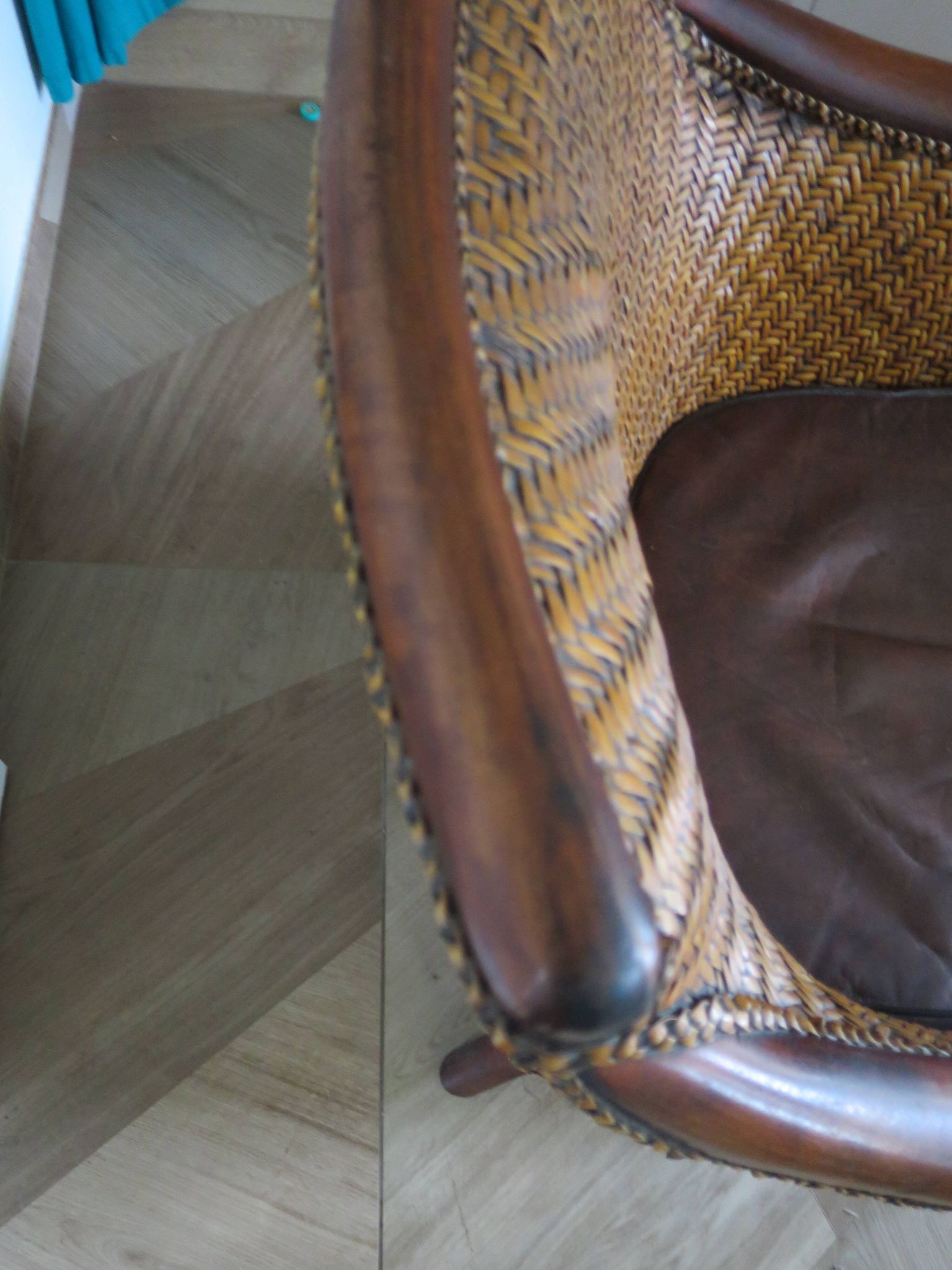 Woven rattan armchair and exotic wood in colonial style, 1980s.