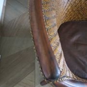 Woven rattan armchair and exotic wood in colonial style, 1980s.