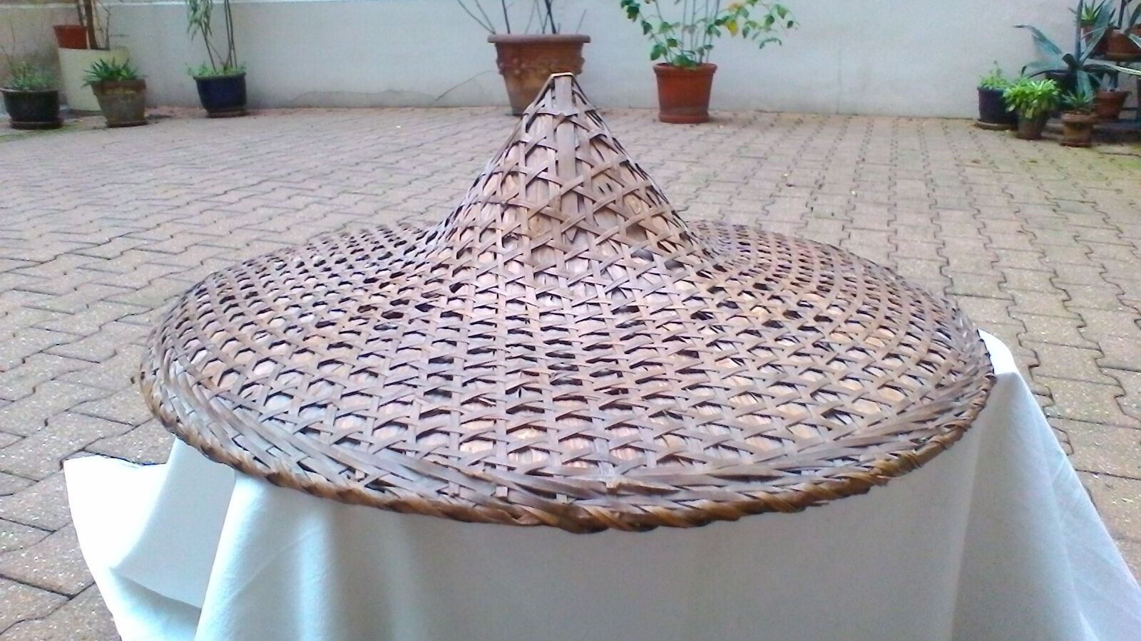 Vintage Asian hat braided palms and bamboo for decoration