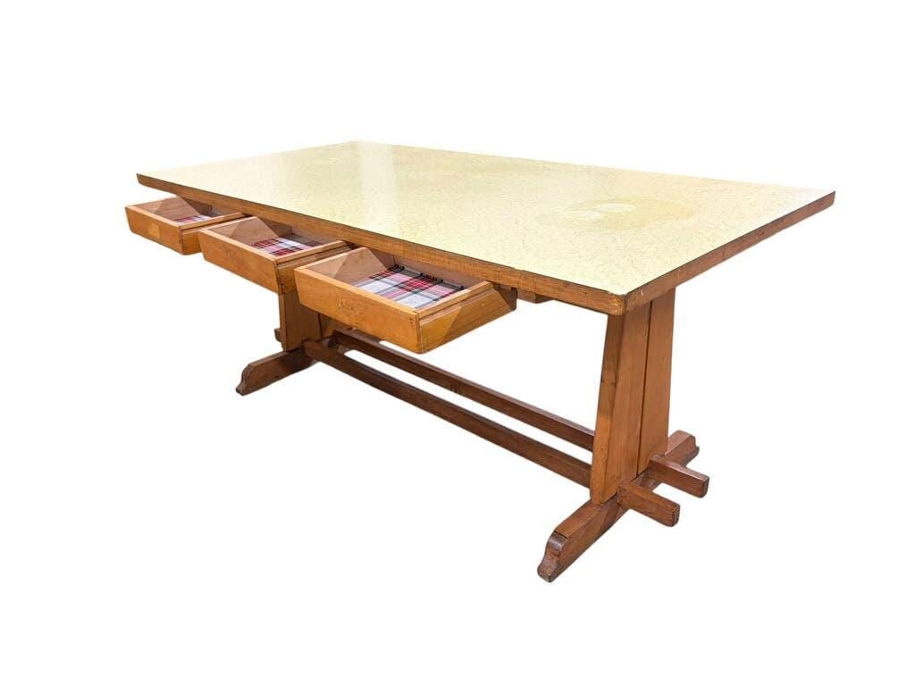 Vintage wooden table with a yellow formica top.
