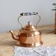 Vintage kettle in copper and ceramic