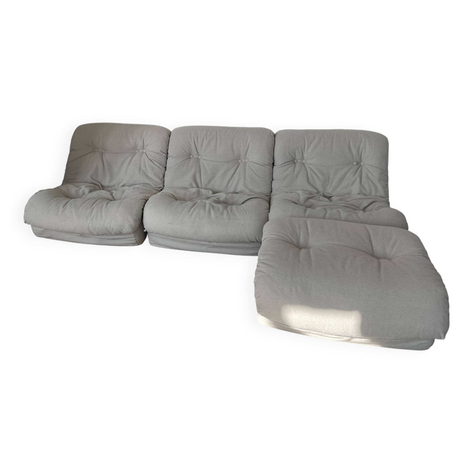 Modular sofa with 3 armchairs and an ottoman.