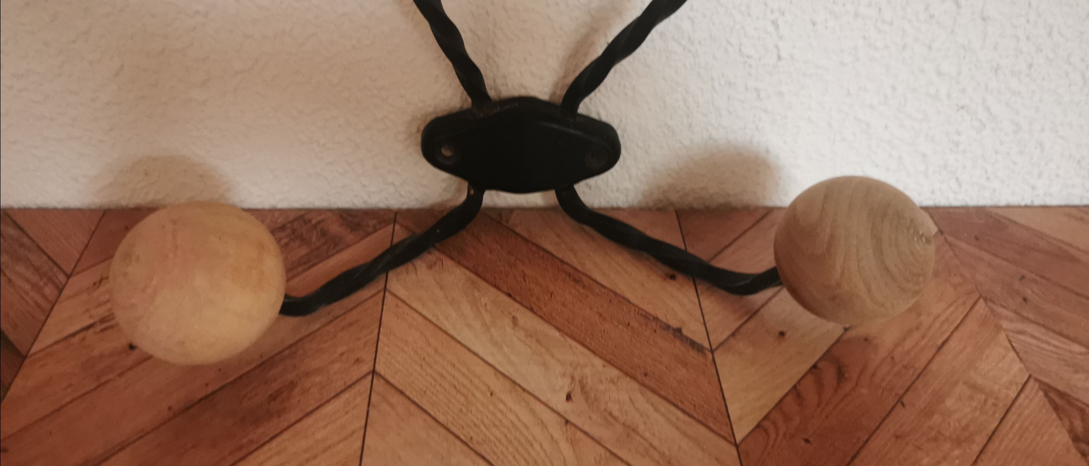 Wooden and iron wall coat holder