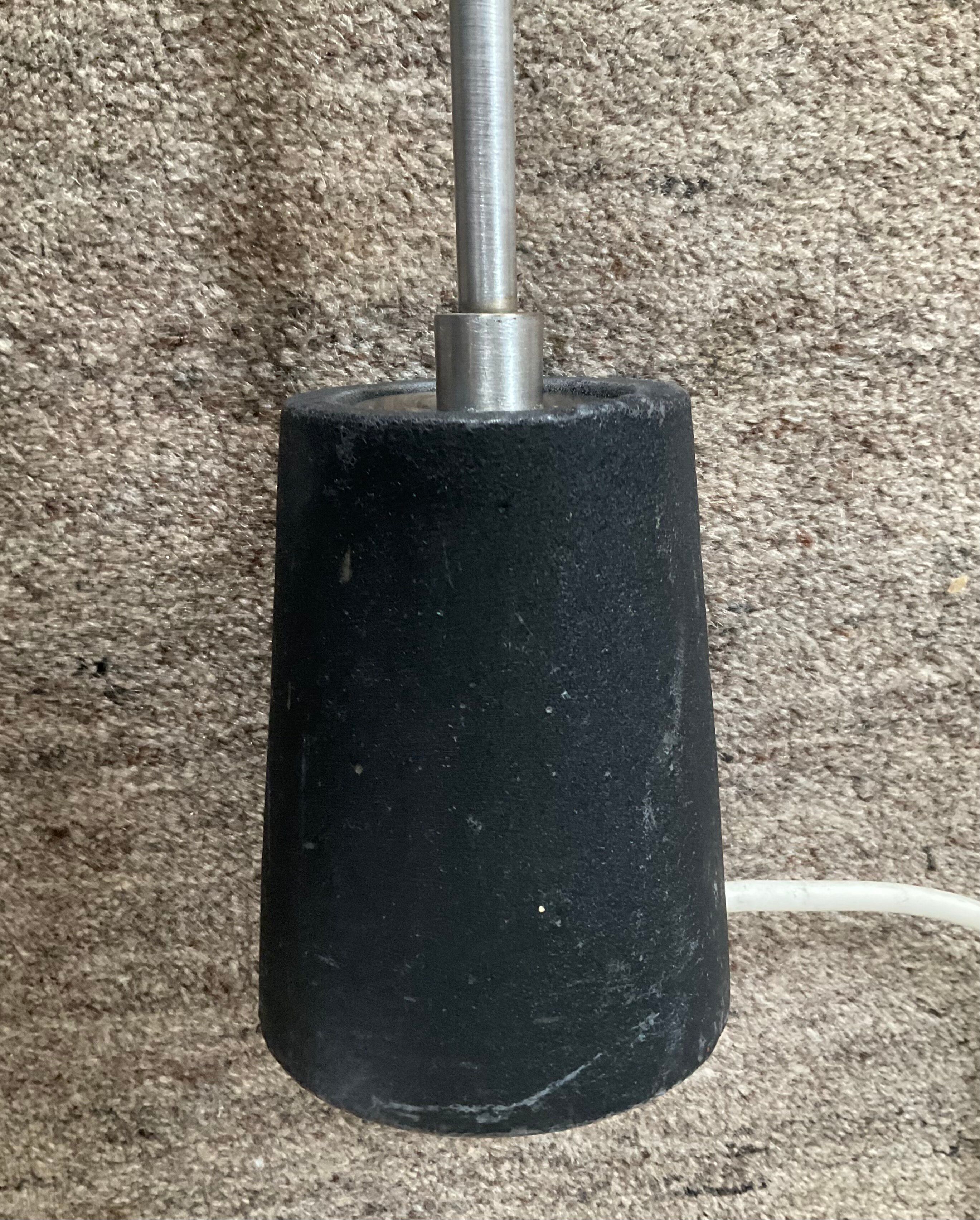 Minimalist floor lamp in cast iron and chrome metal