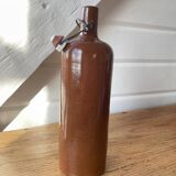 Old hot water bottles in glazed sandstone
