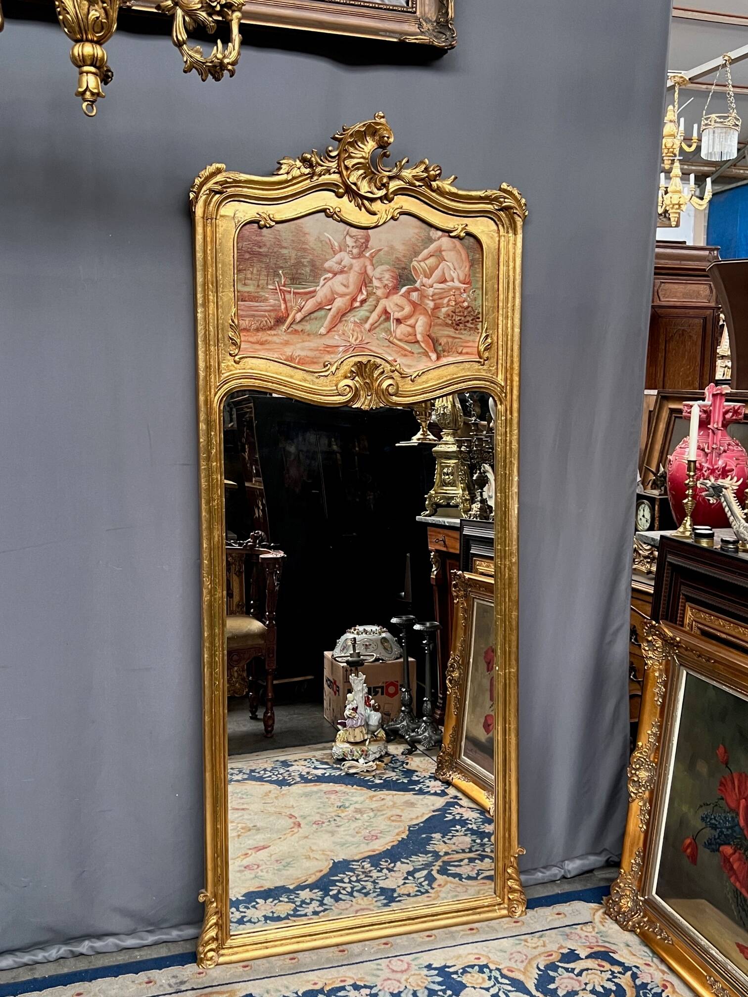 Antique Rococo mirror with cherubs