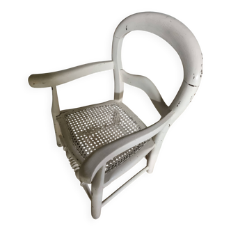 Low wooden children's chair with canework