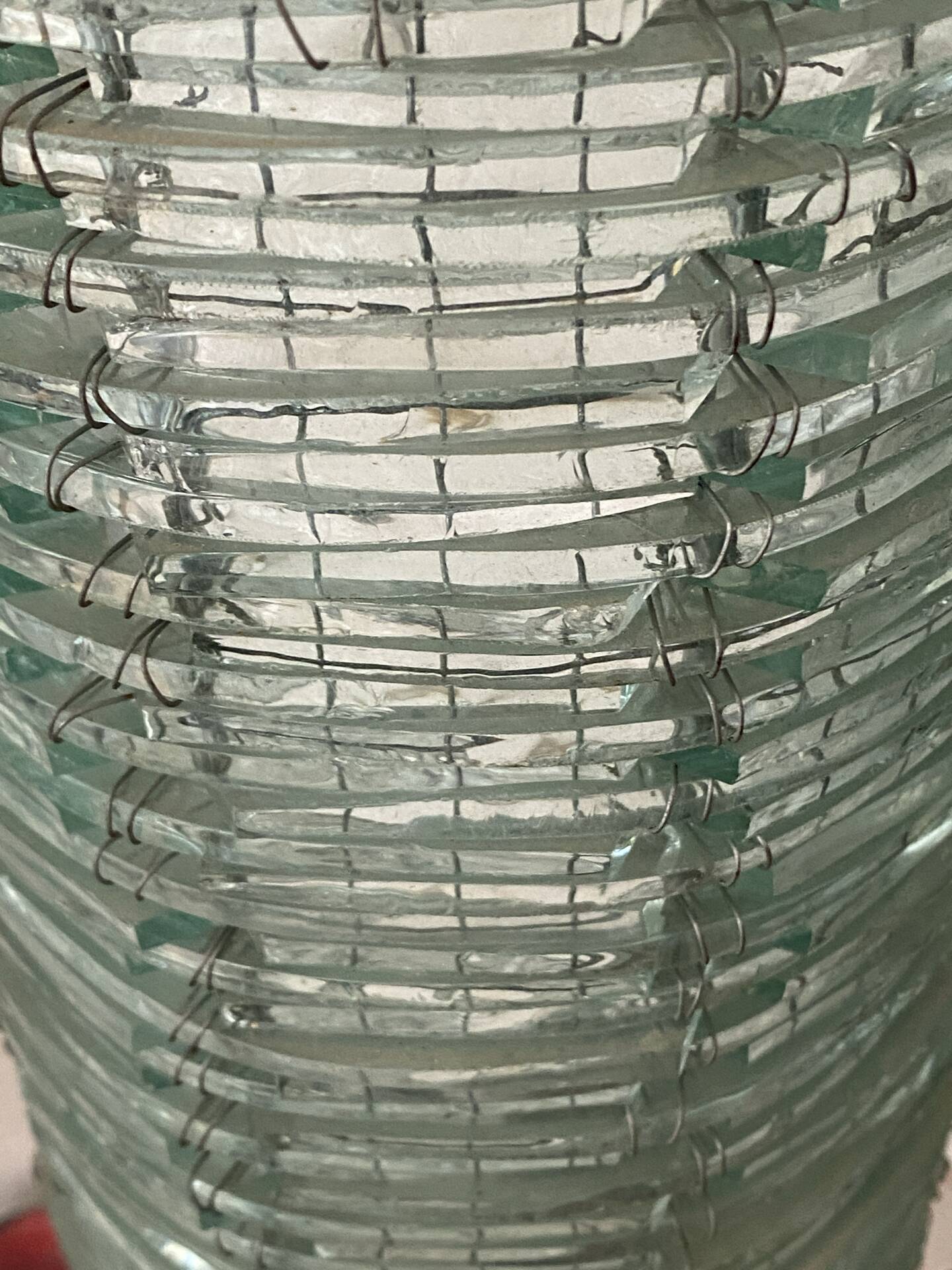 Blue-tinted glass lamp and wire.