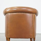 Sheep leather club chair in neutral cognac colour and in good condition