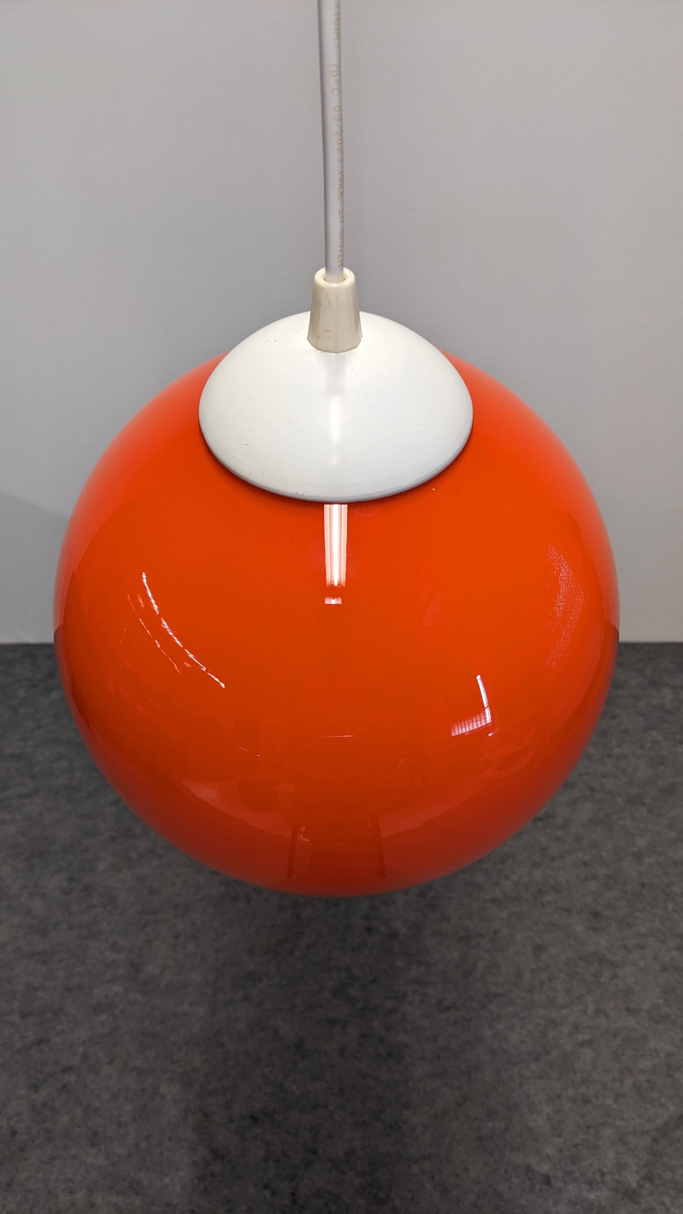 Orange opaline ball pendant, France circa 1970.