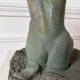 Sculpture of a naked woman titled "Youth" in terracotta.