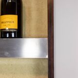 Circular bar in brushed metal, wood and carpet. 1970s.