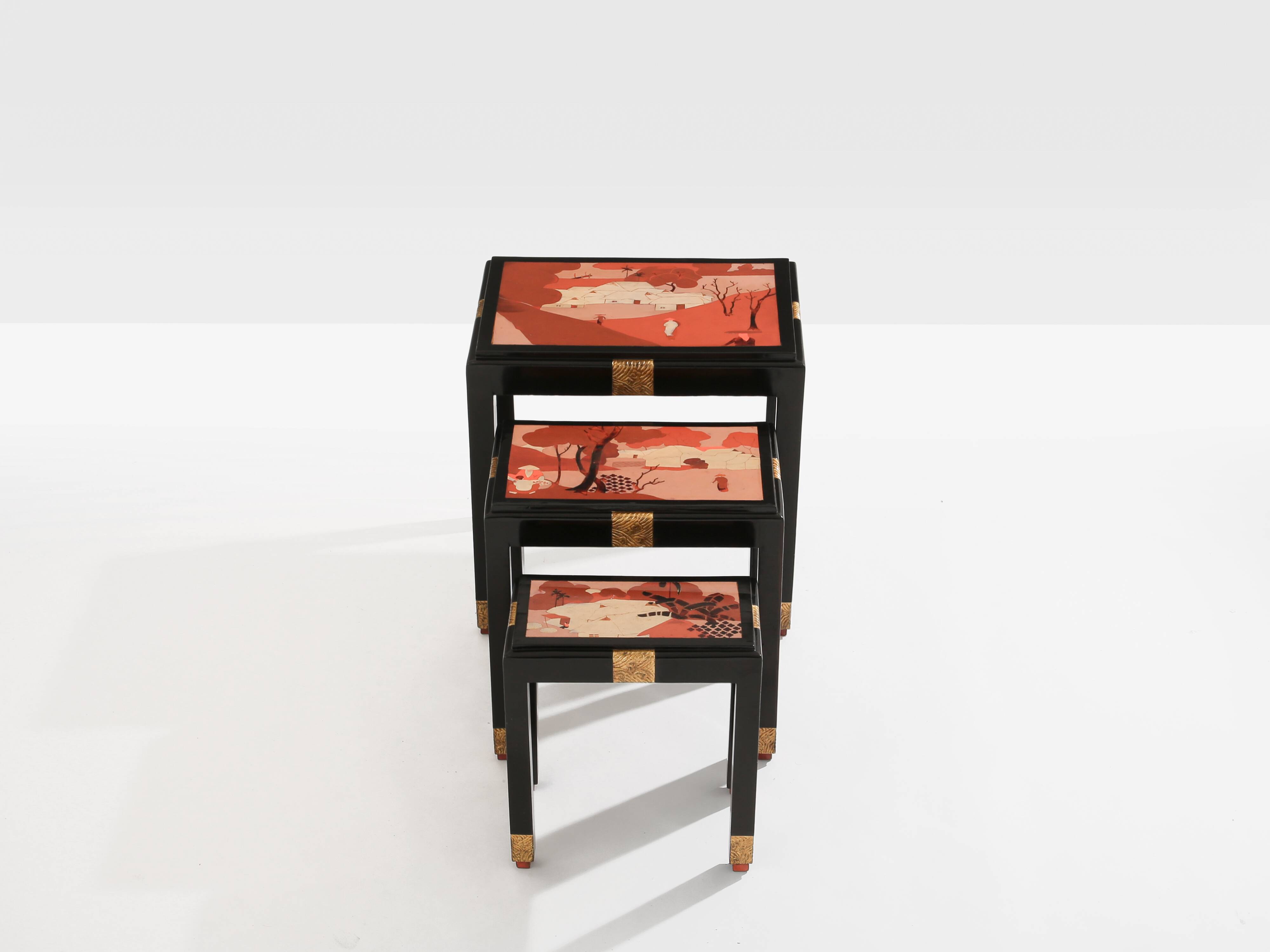 Set of three nesting tables with Asian decor, blackened wood, circa 1920.