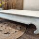 Exotic wood coffee table with its safety glass protection.