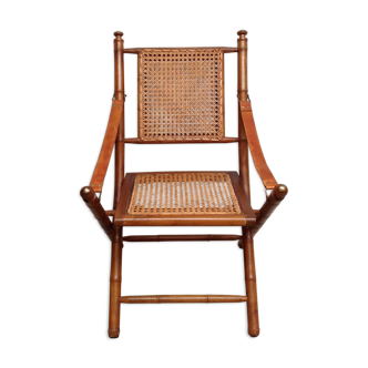 Bamboo folding armchair and caning, leather and brass
