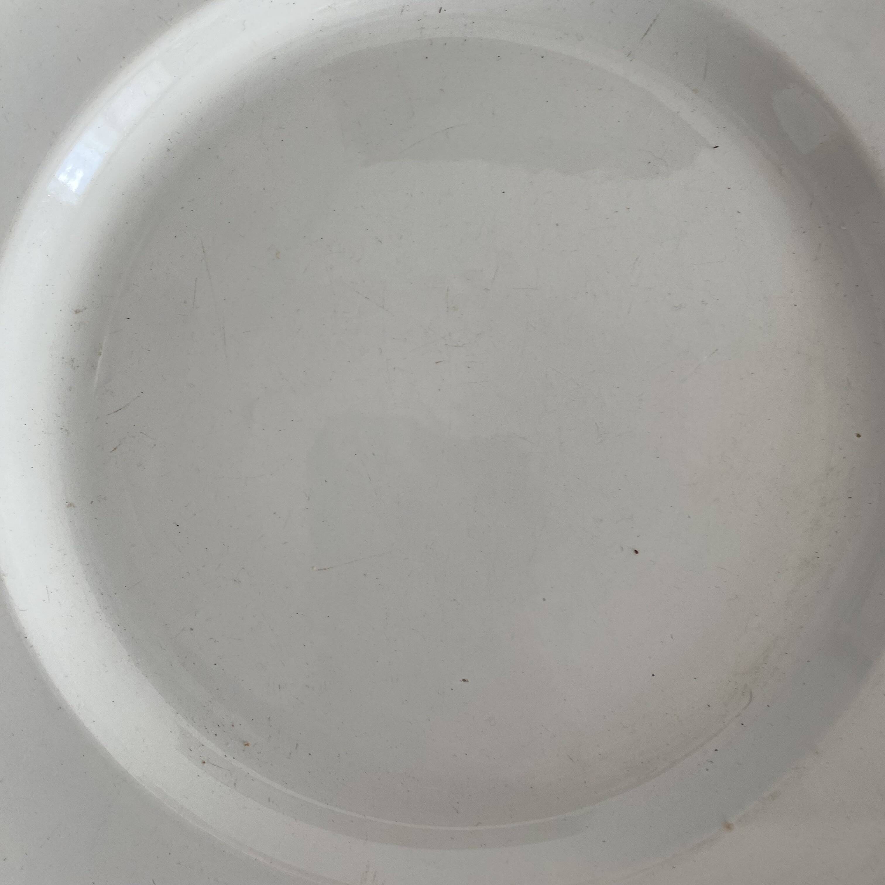 Set of large round white earthenware dishes from Creil and Montereau, 19th century