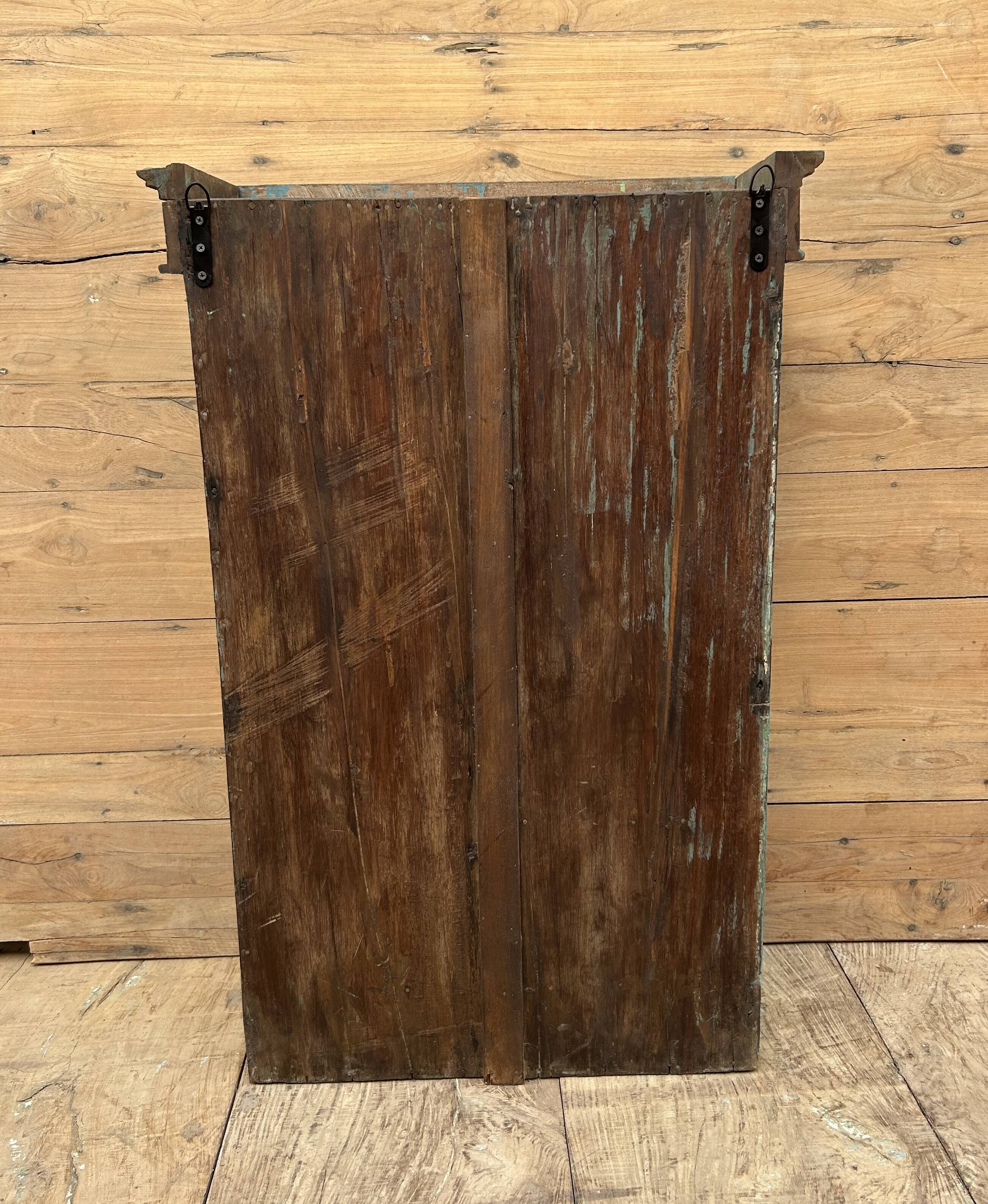 Wall display cabinet in Burmese teak with original patina.