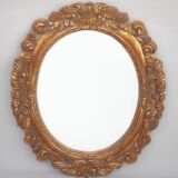 Miroir ovale doré et sculpté en bois. Miroir vintage. Miroir mural.