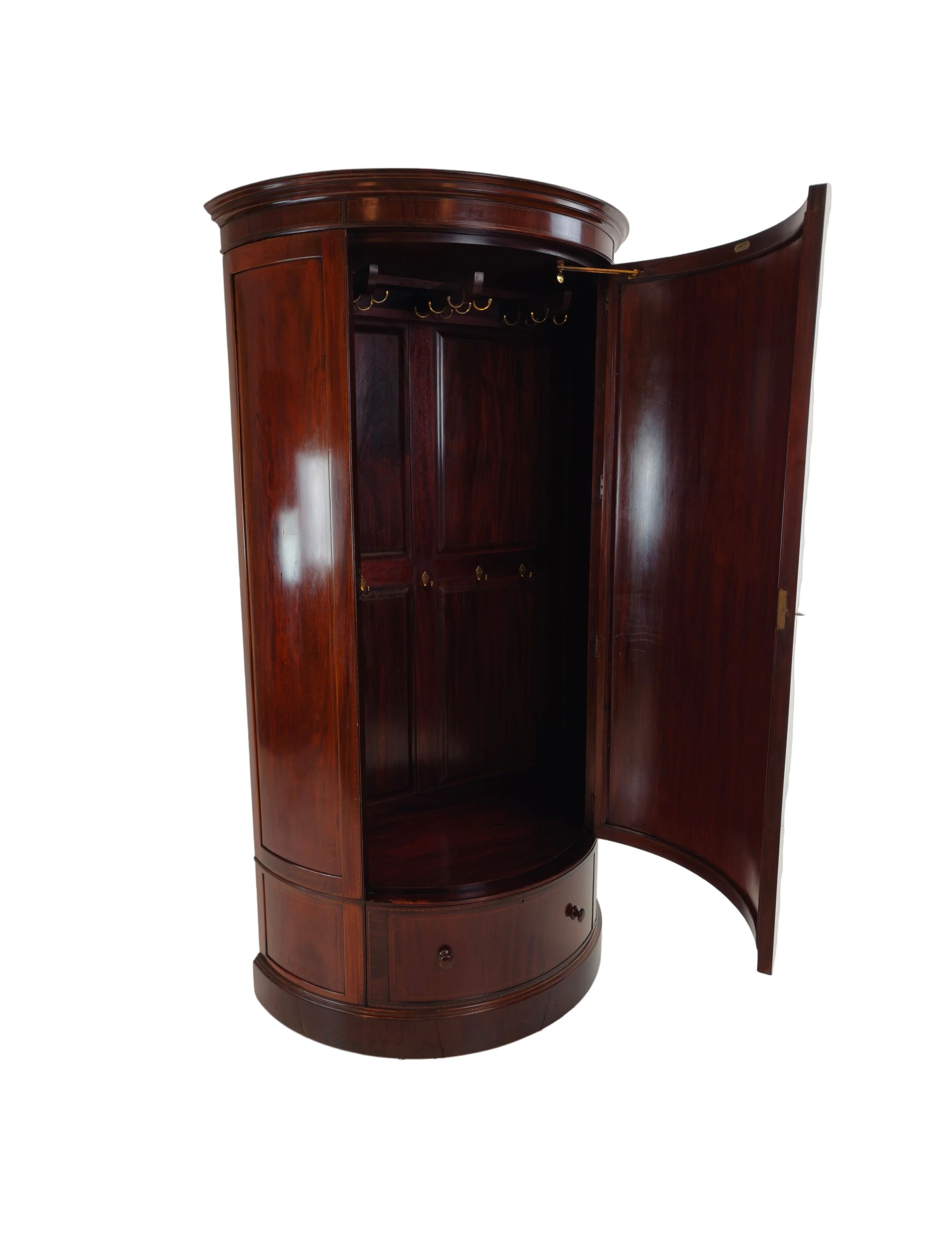 Edwardian mahogany bow-fronted wardrobe by Maple & Co