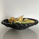 Large woven bowl and trompe l'œil fruits