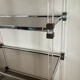 Vintage shelf in lucite, brass, and smoked glass from the 1970s.