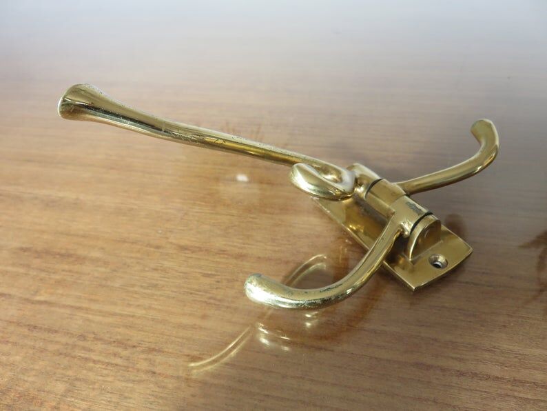 70s brass swivel coat door