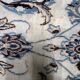 1950s hand-knotted wool rug with silk highlights, ivory and blue, 118 × 200 cm