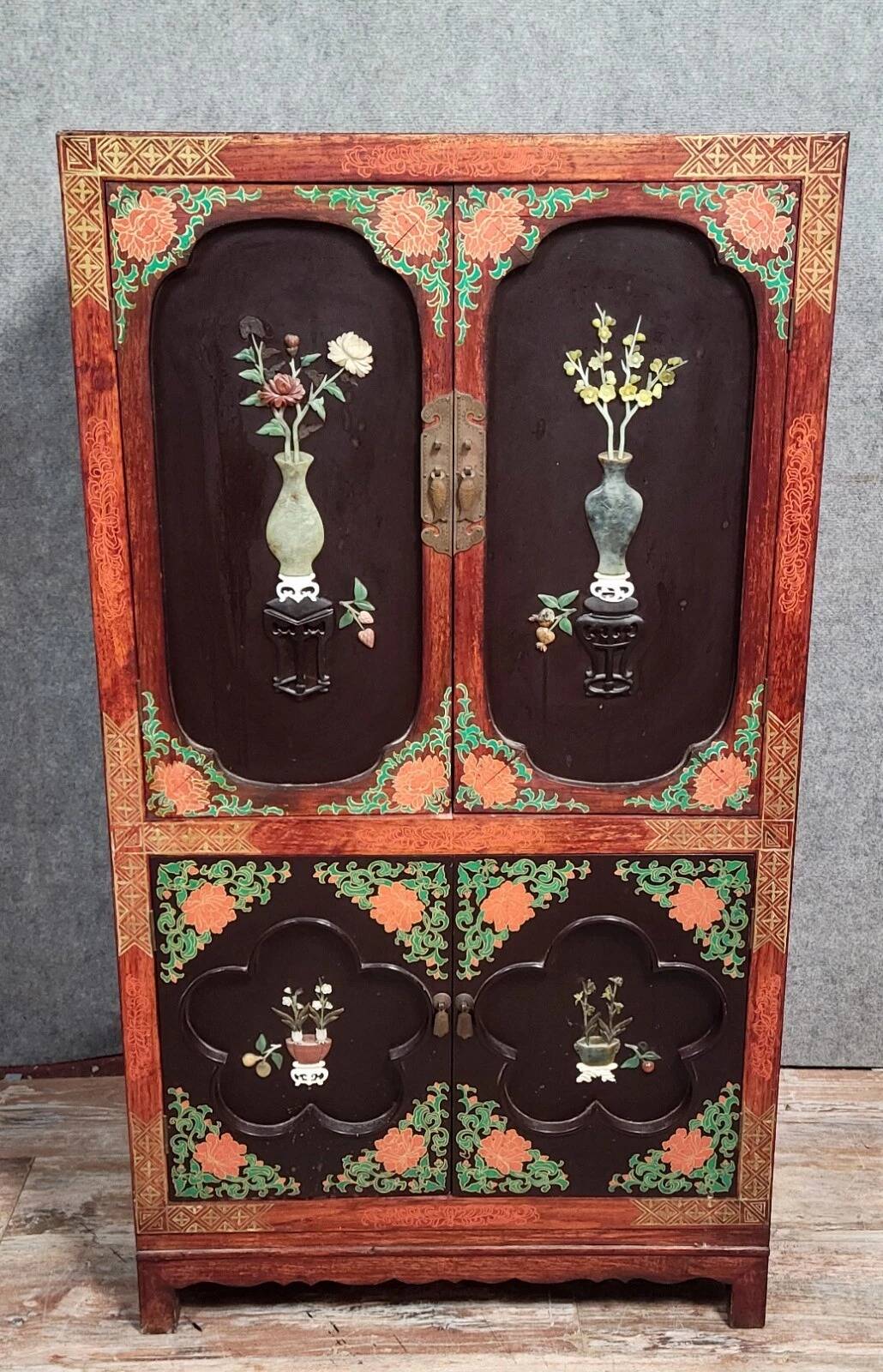 Asia, 20th century: Lacquered cabinet decorated with vases of flowers in hardstone