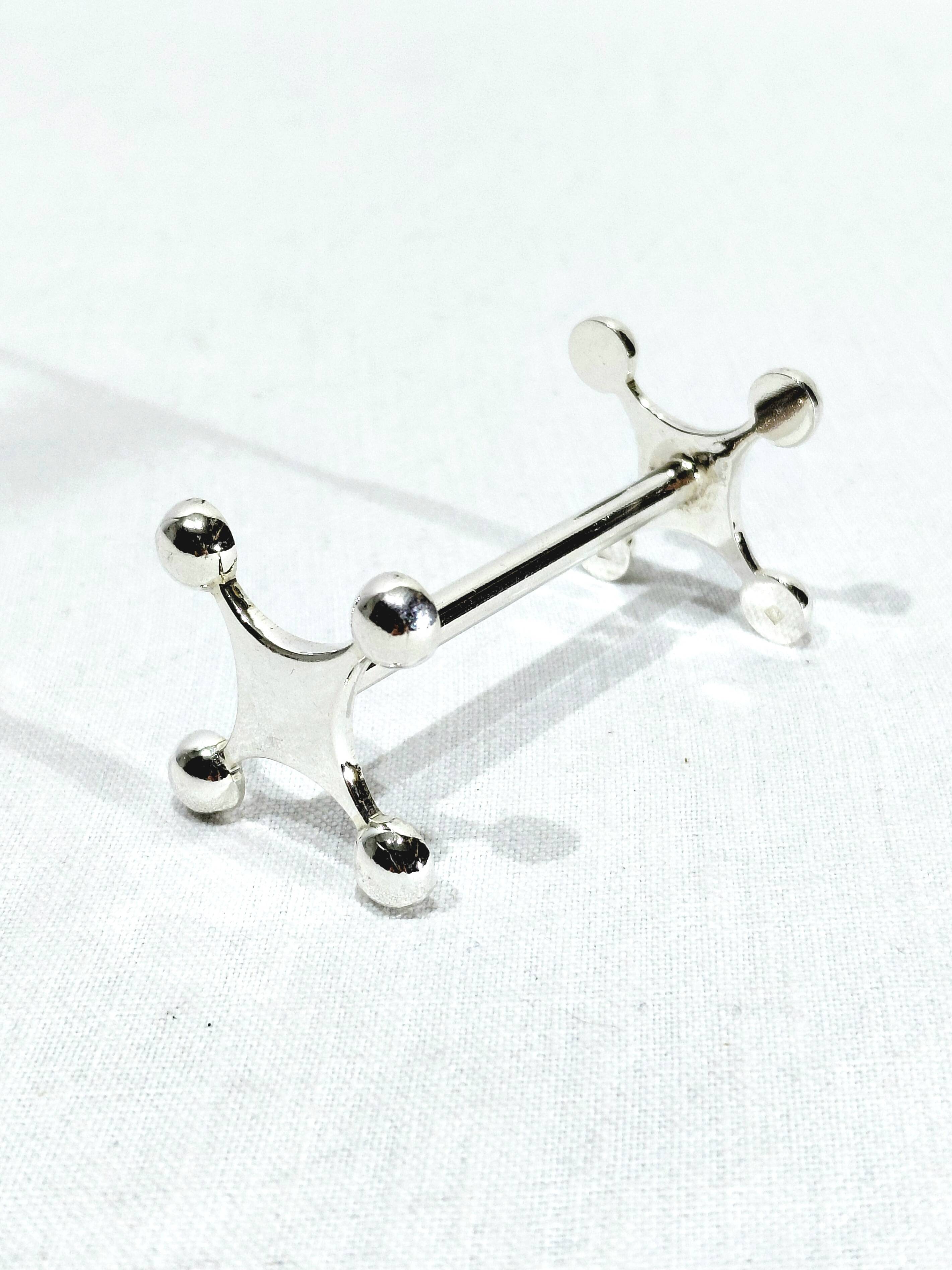 SET OF 12 SILVER-PLATED KNIFE RESTS