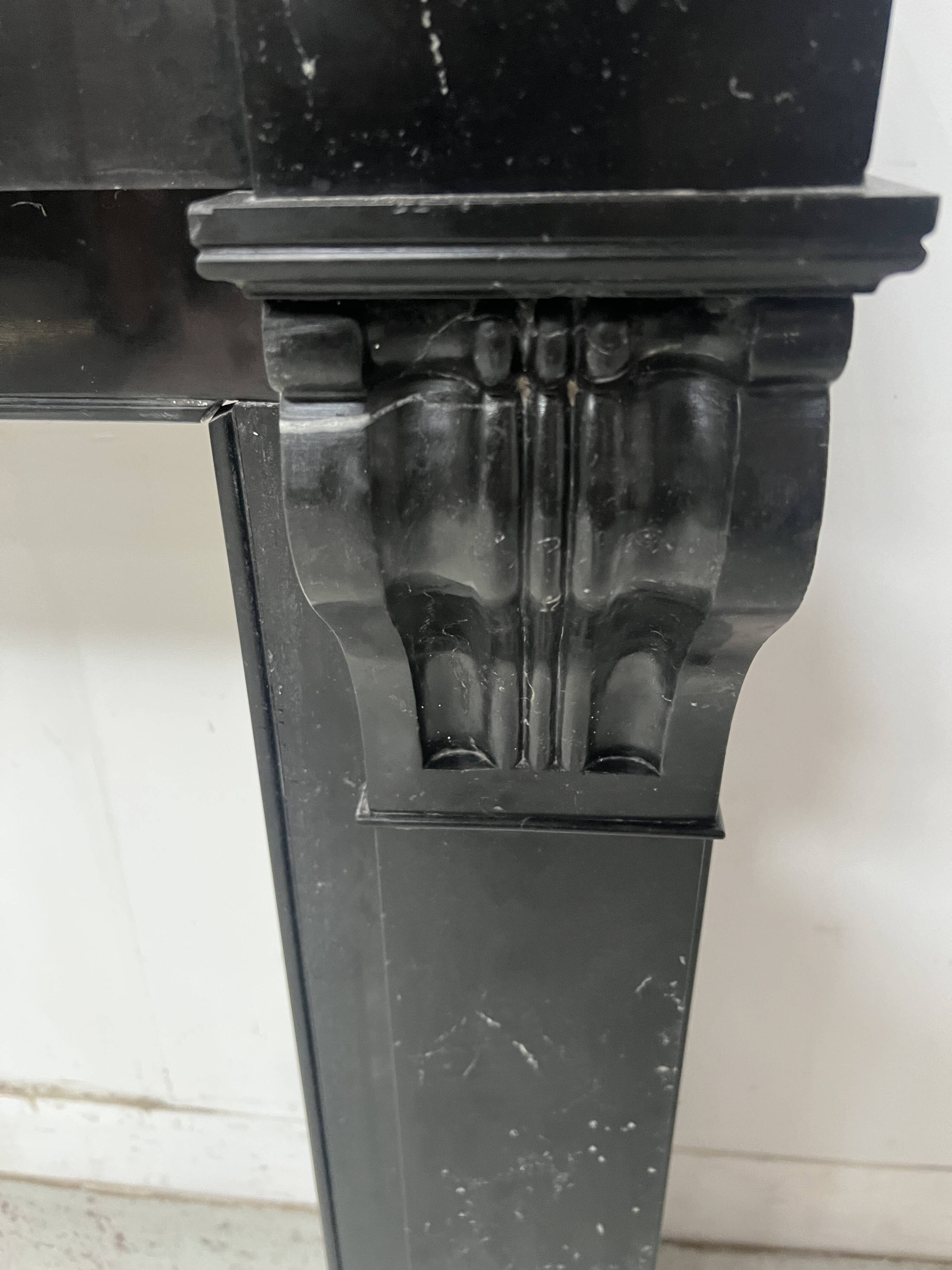 Napoleon III period fireplace with a black marble corbel. 19th century.
