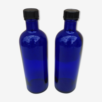 2 bottles in cobalt blue glass from an apothecary