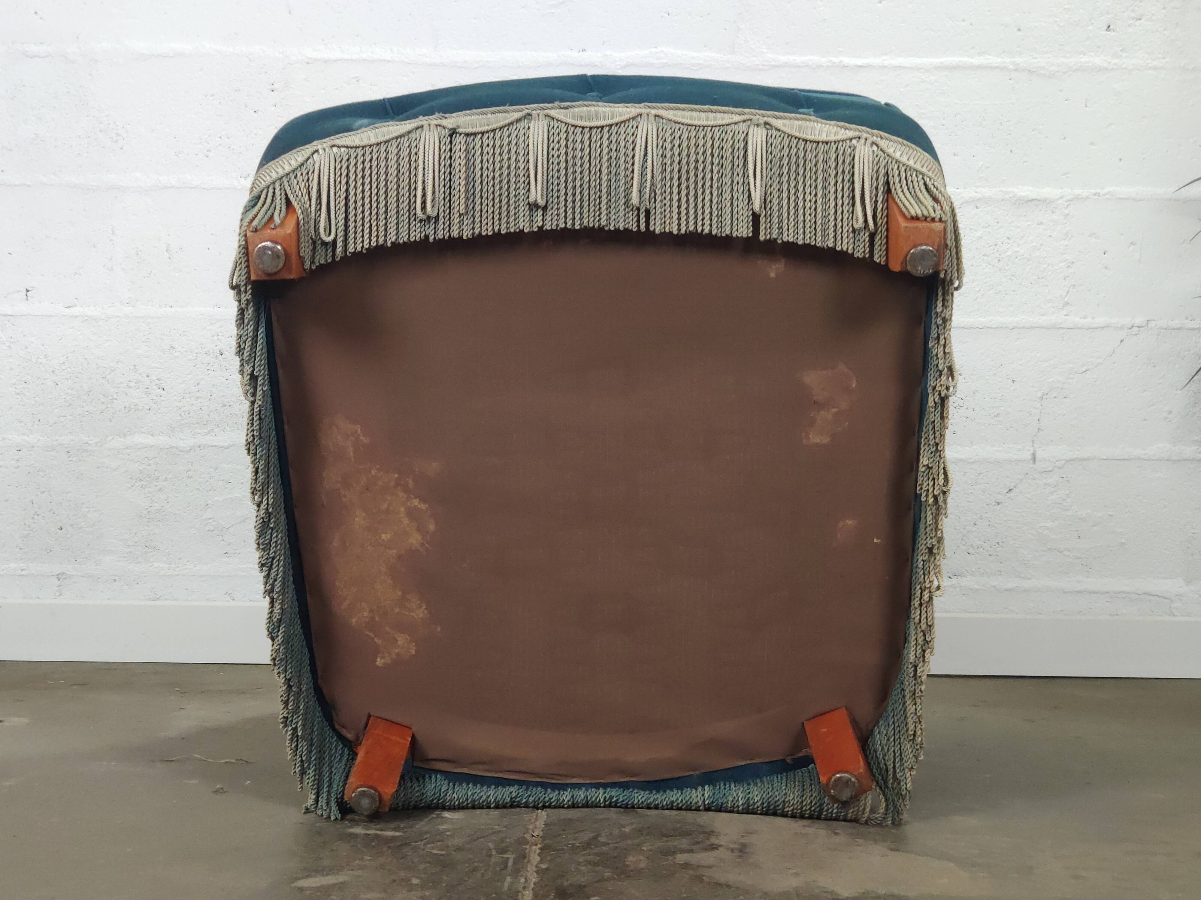 Pair of blue velvet armchairs with fringes