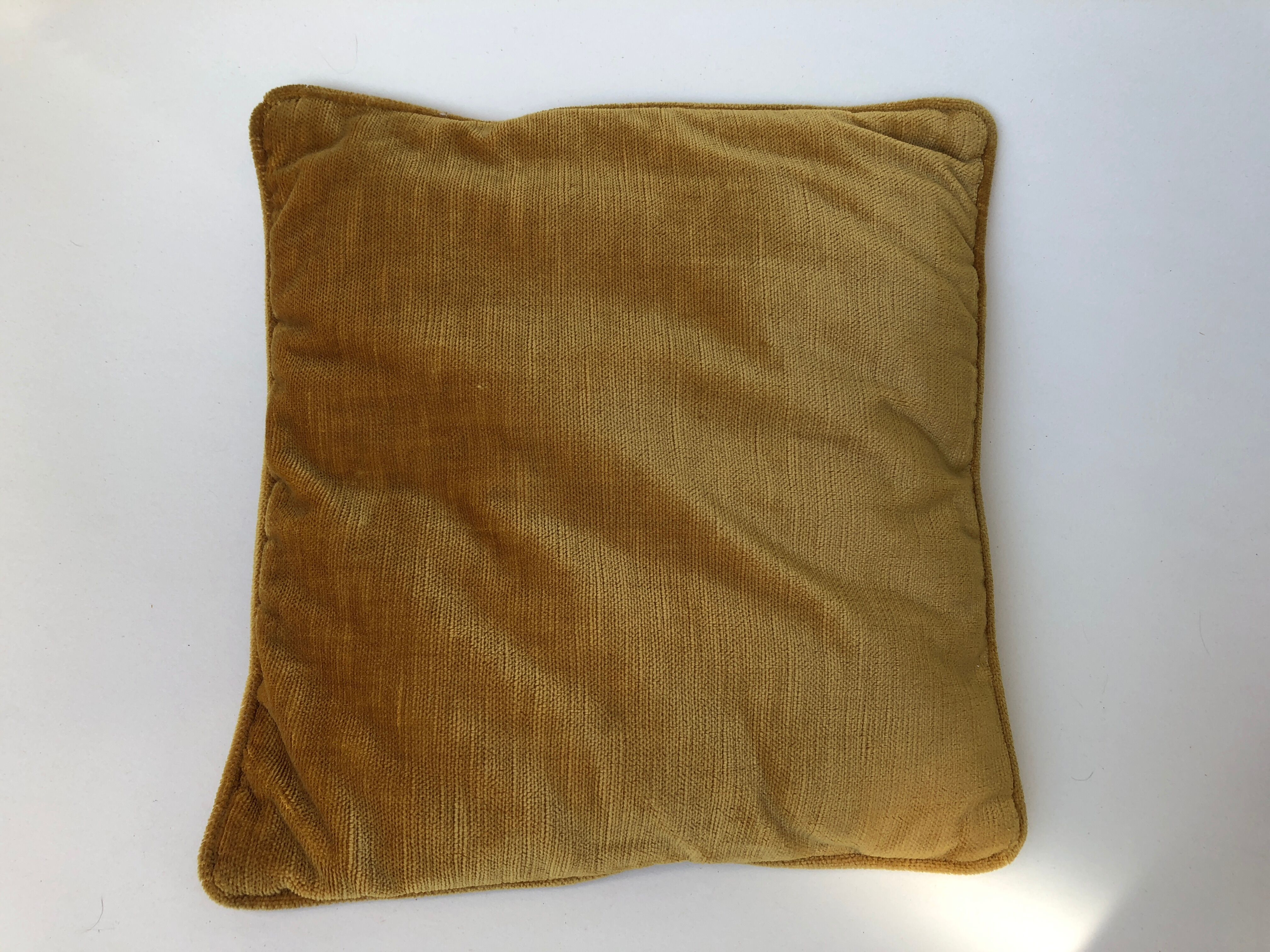 Golden yellow color velvet cushion