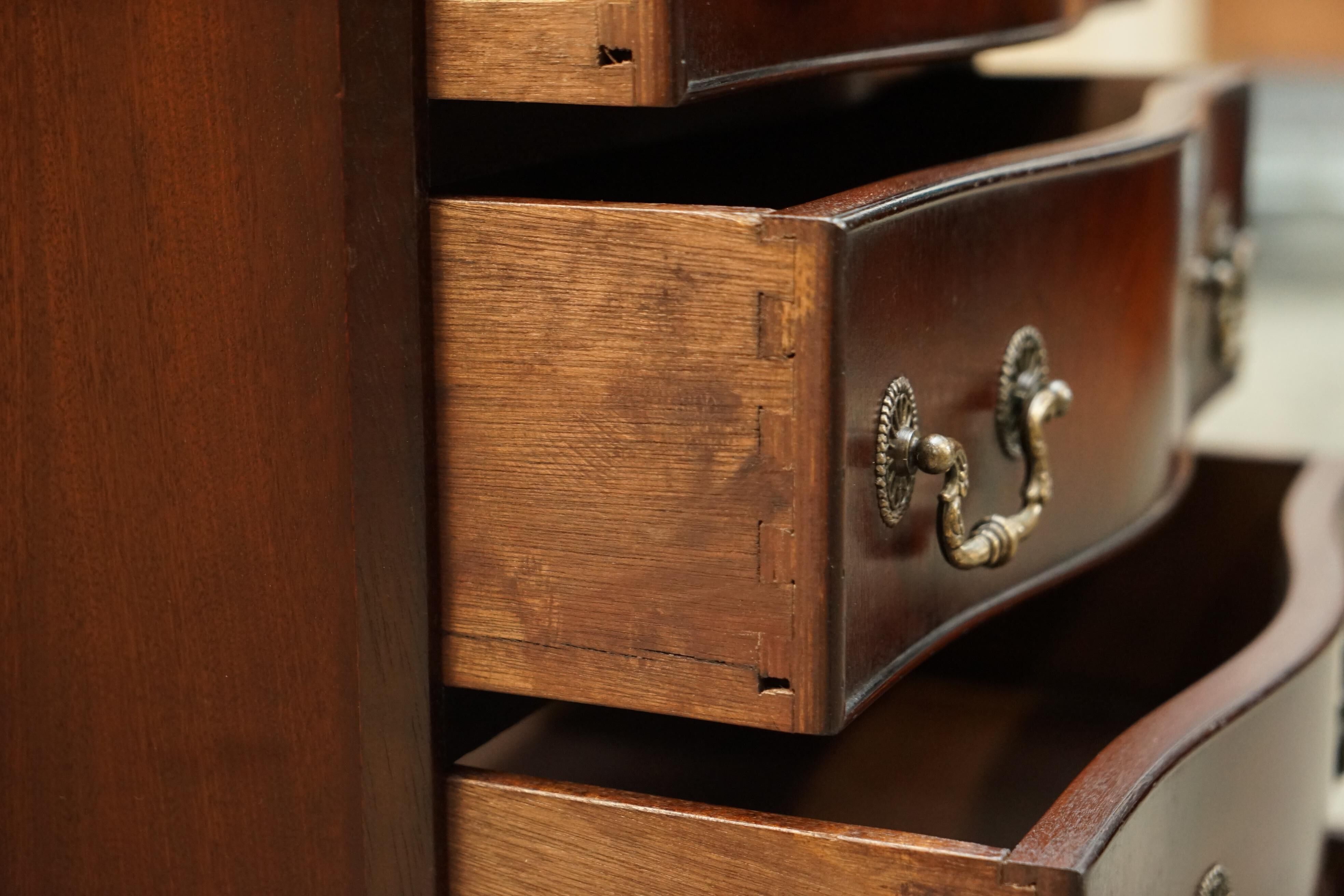 Vintage serpentine front hardwood chest of drawers