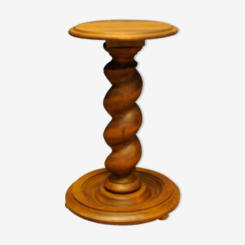 Ancient pedestal with a spiral stem