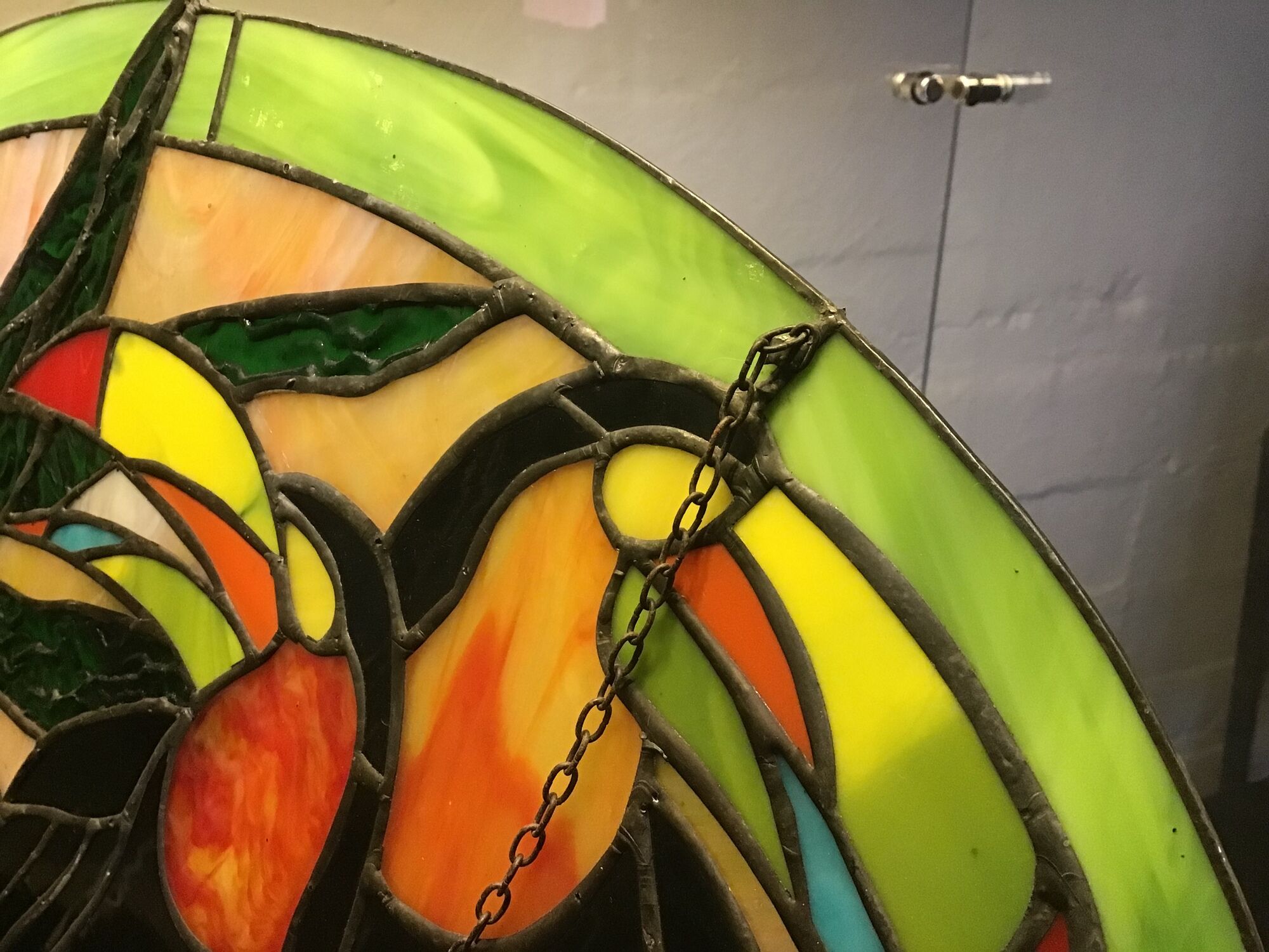 Art Deco style stained glass window representing a couple of toucans