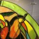Art Deco style stained glass window representing a couple of toucans