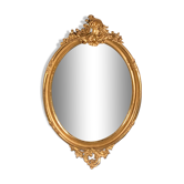 Large oval mirror in gilded wood