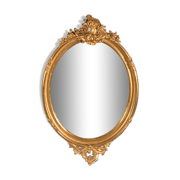 Grand miroir ovale en bois doré
