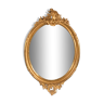 Grand miroir ovale en bois doré