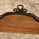 Old wrought iron console with a fleur-de-lis design.