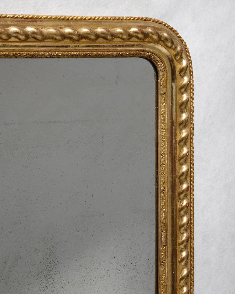 Louis-Philippe mirror with a geometric scalloped frame